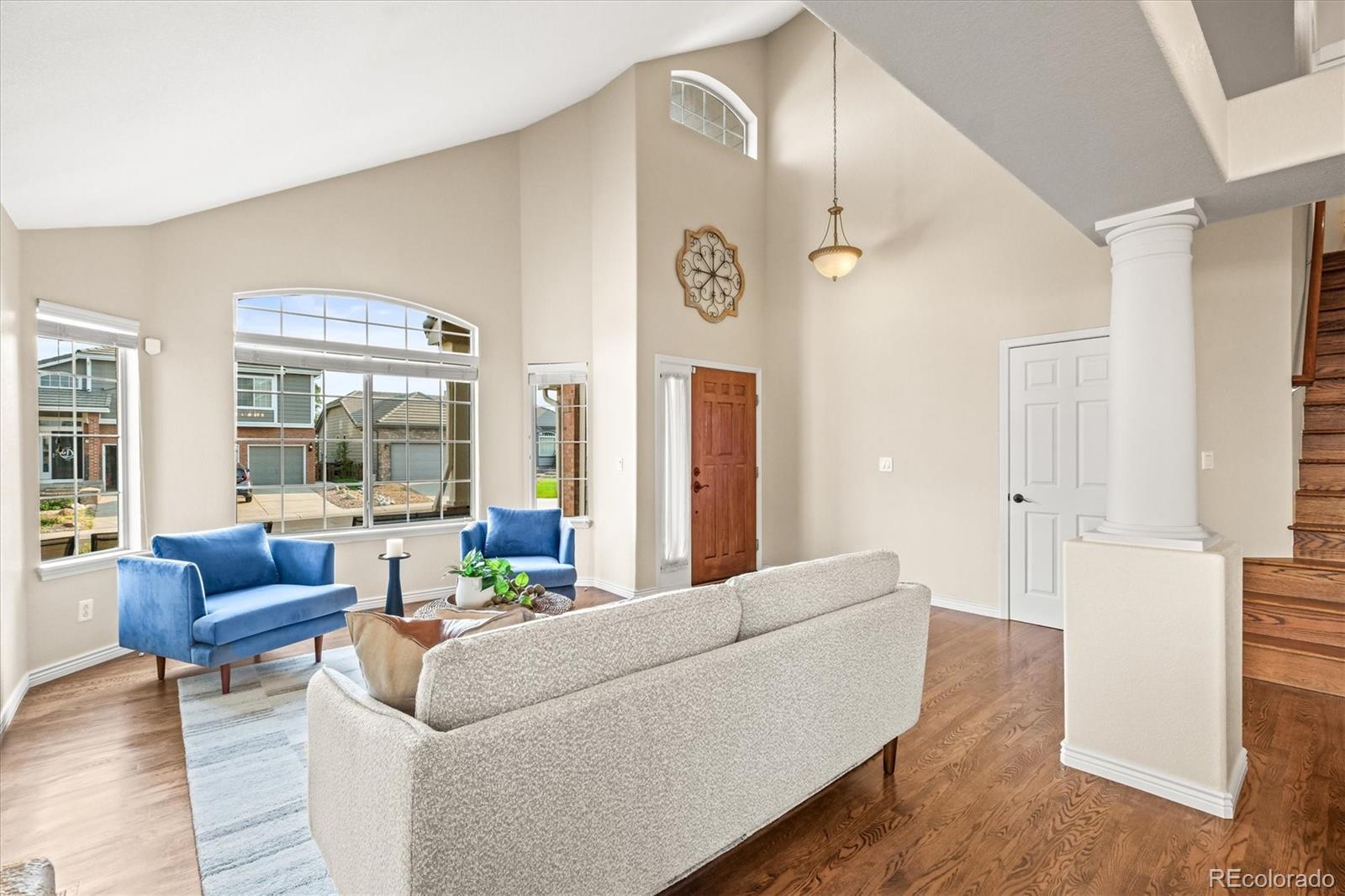 3115 White Oak Lane Highlands Ranch, CO 80129 - Photo 4 of 43 a living room with furniture and a large window