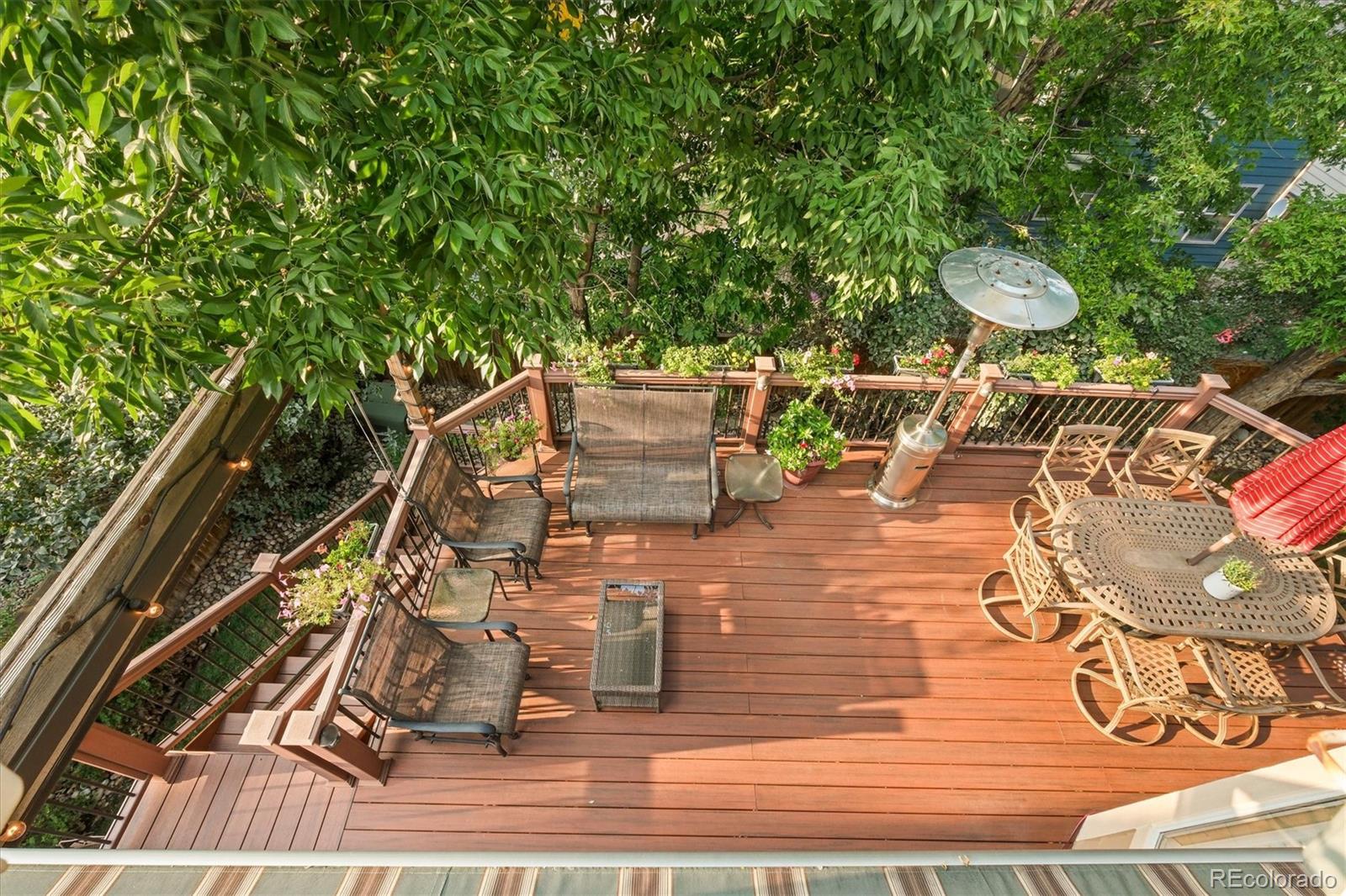 3115 White Oak Lane Highlands Ranch, CO 80129 - Photo 41 of 43 a view of a balcony with chairs and wooden floor