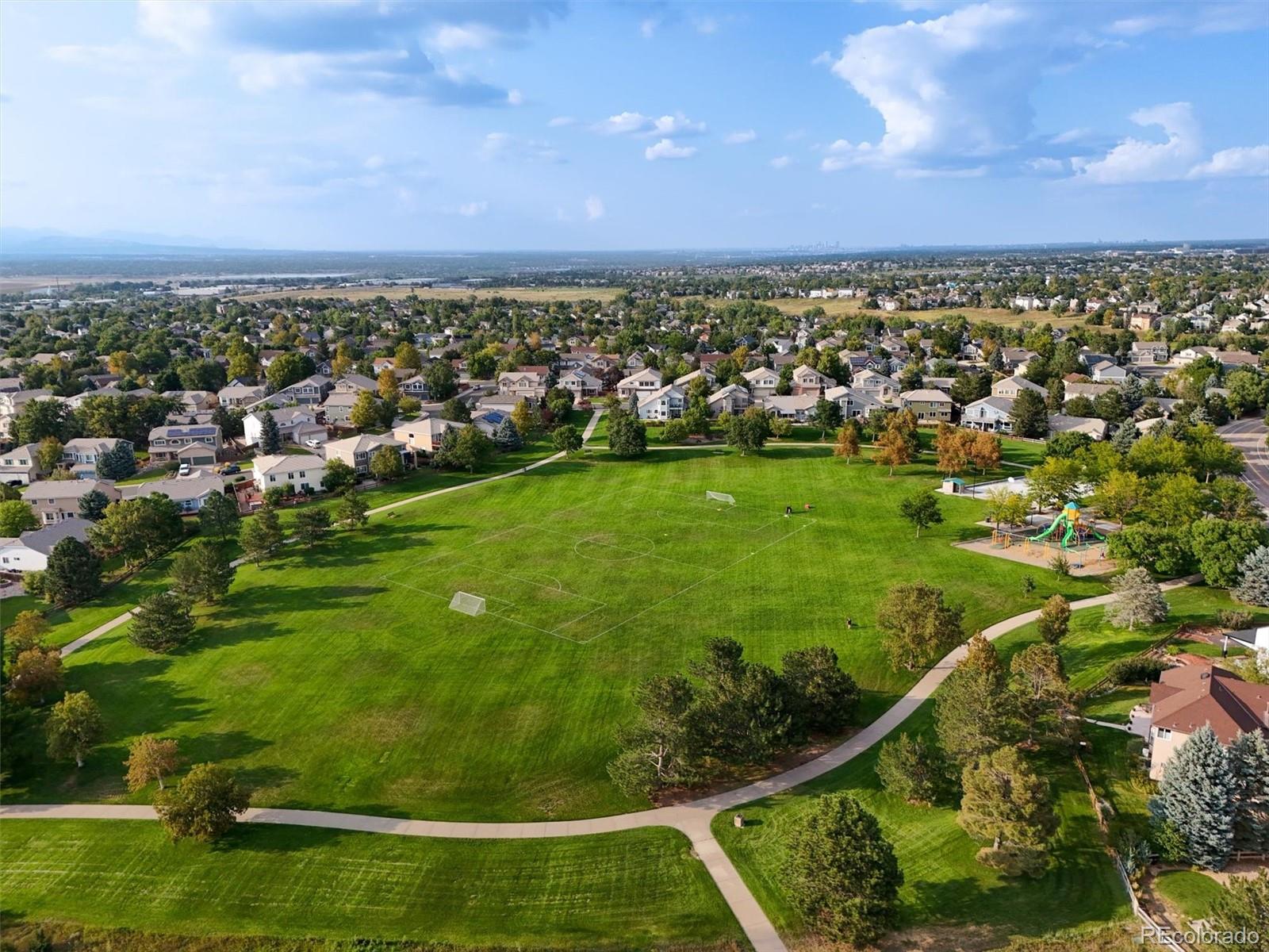 3115 White Oak Lane Highlands Ranch, CO 80129 - Photo 42 of 43 an aerial view of residential houses with outdoor space and trees