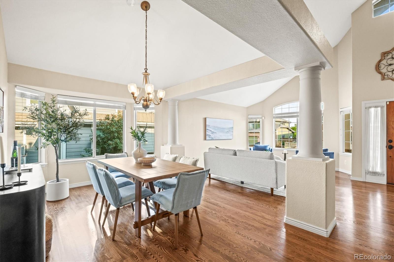 3115 White Oak Lane Highlands Ranch, CO 80129 - Photo 5 of 43 a view of a dining room with furniture window and wooden floor