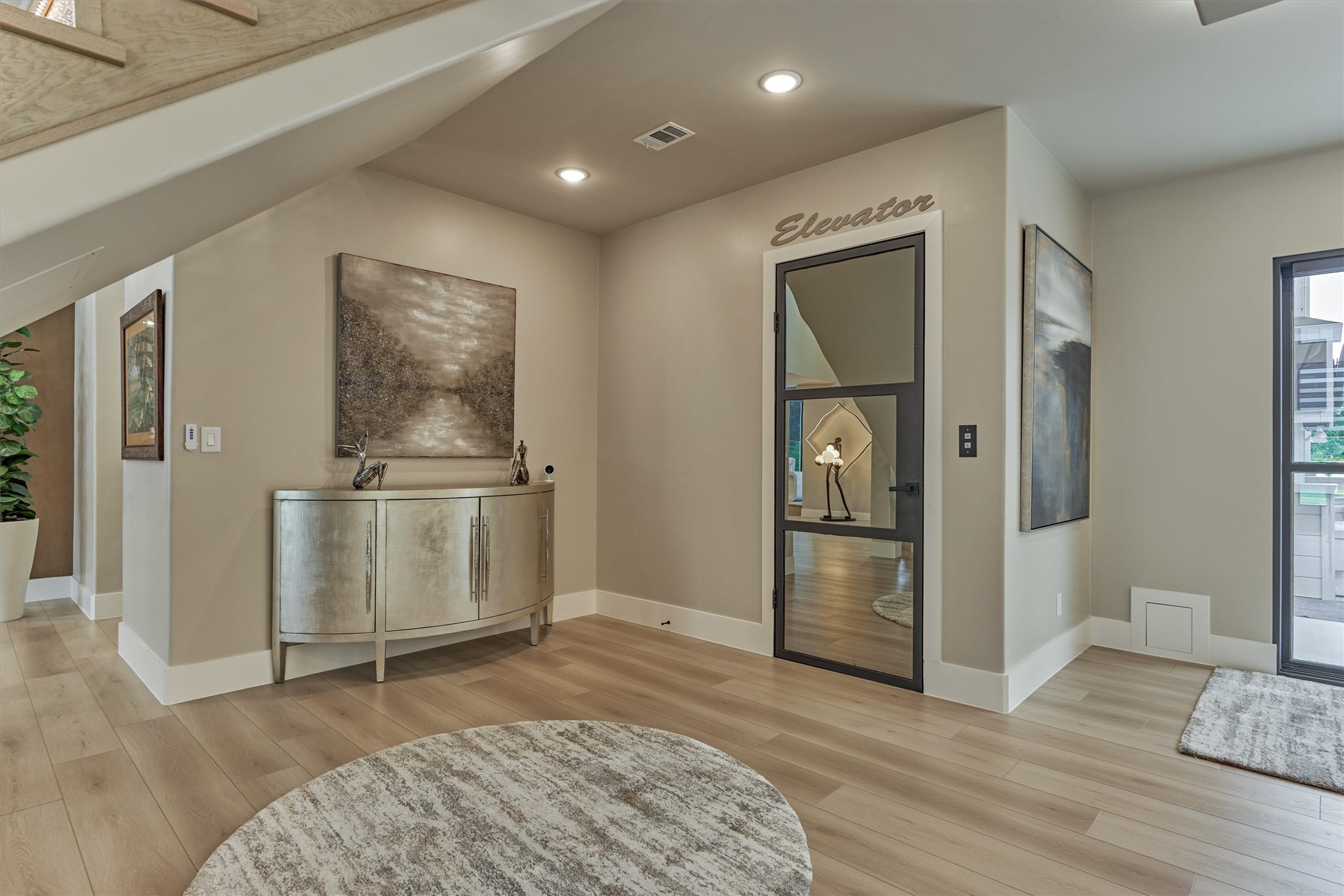 1907 Woerner Road Houston, TX 77090 - Photo 9 of 50 Located off the staircase, the elevator provides easy and luxurious access to the second floor.