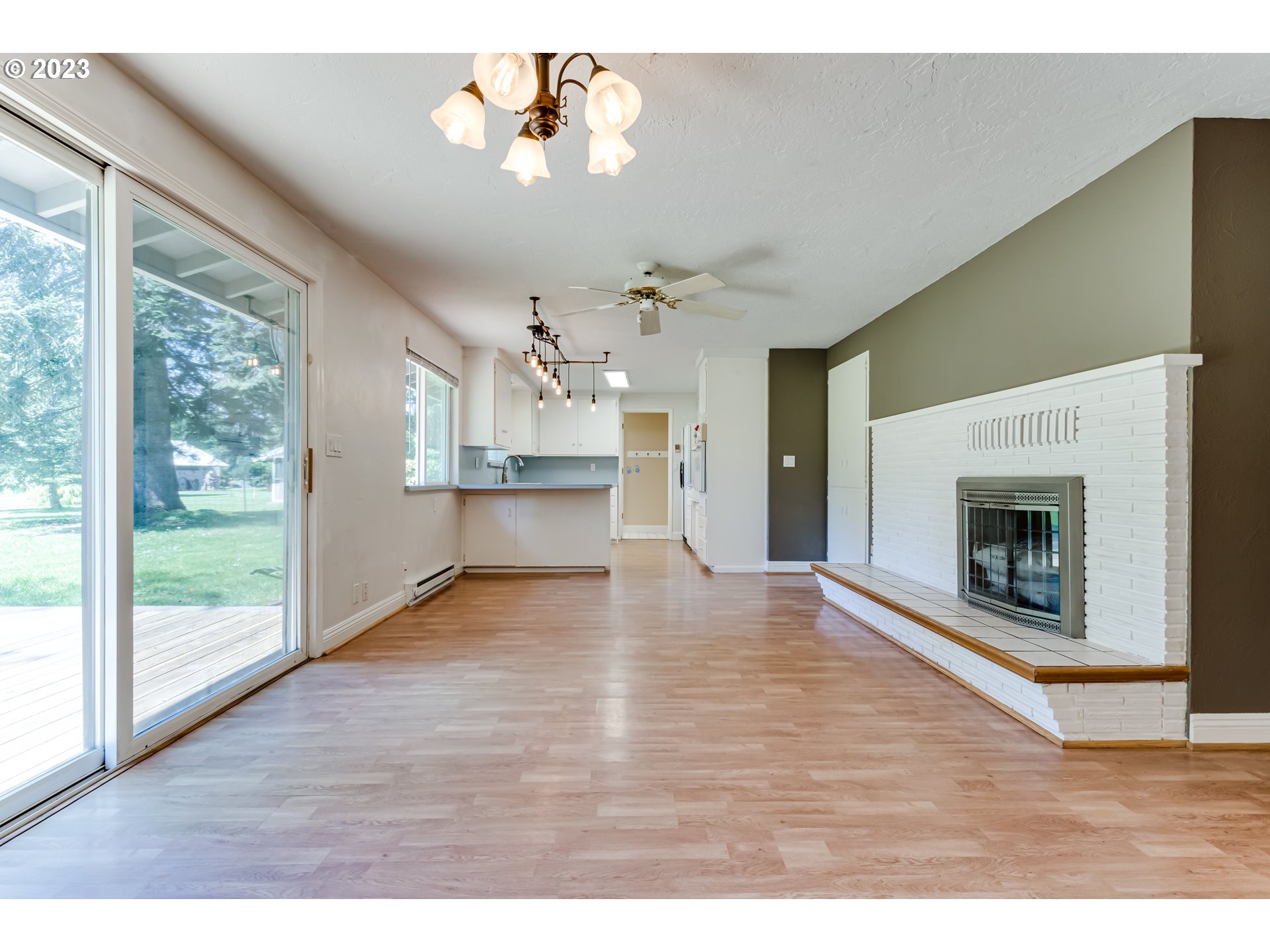 34886 Mathews Road Eugene, OR 97405 - Photo 14 of 48 a view of a livingroom with a fireplace and wooden floor