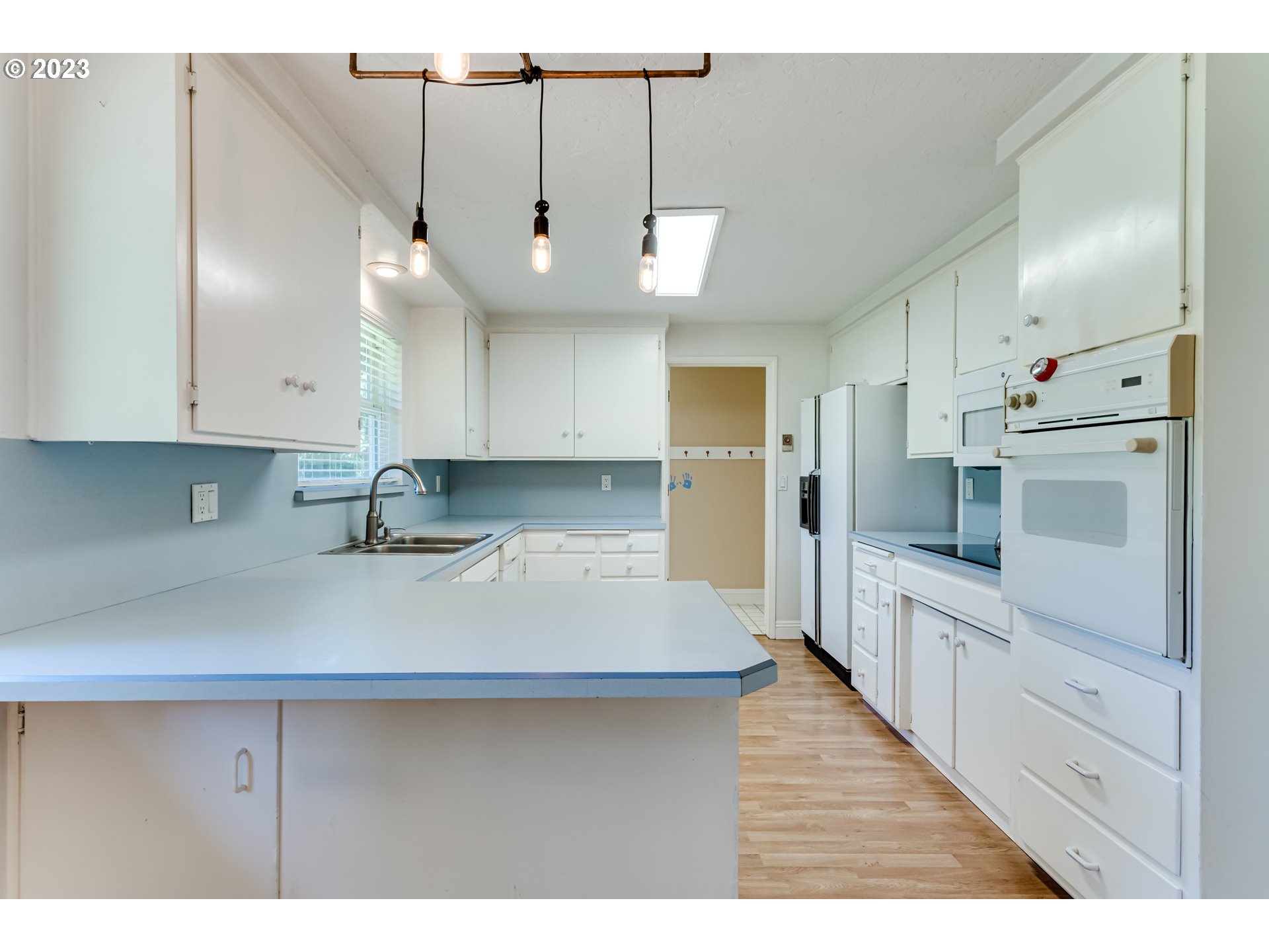 34886 Mathews Road Eugene, OR 97405 - Photo 16 of 48 a kitchen with kitchen island a sink stainless steel appliances and cabinets