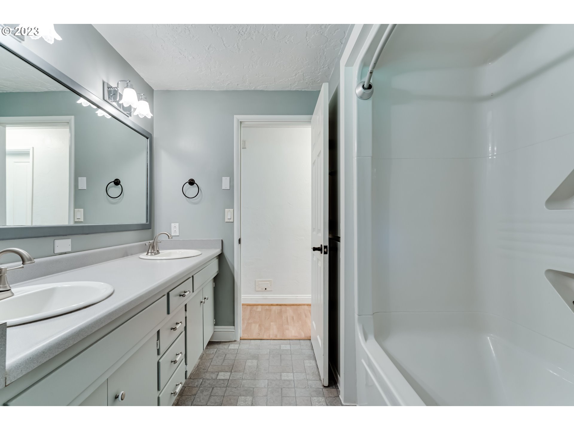 34886 Mathews Road Eugene, OR 97405 - Photo 20 of 48 a bathroom with a sink a mirror and a shower