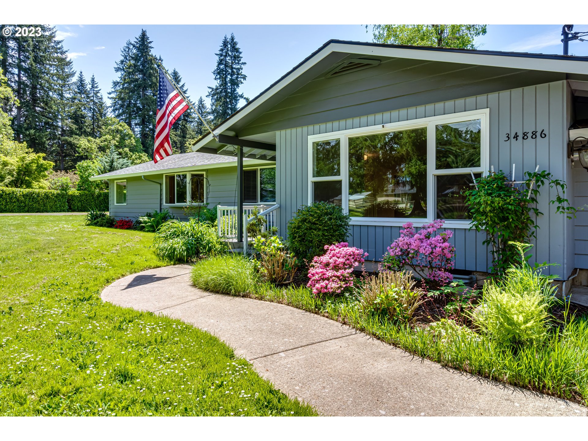 34886 Mathews Road Eugene, OR 97405 - Photo 2 of 48 a front view of a house with a yard