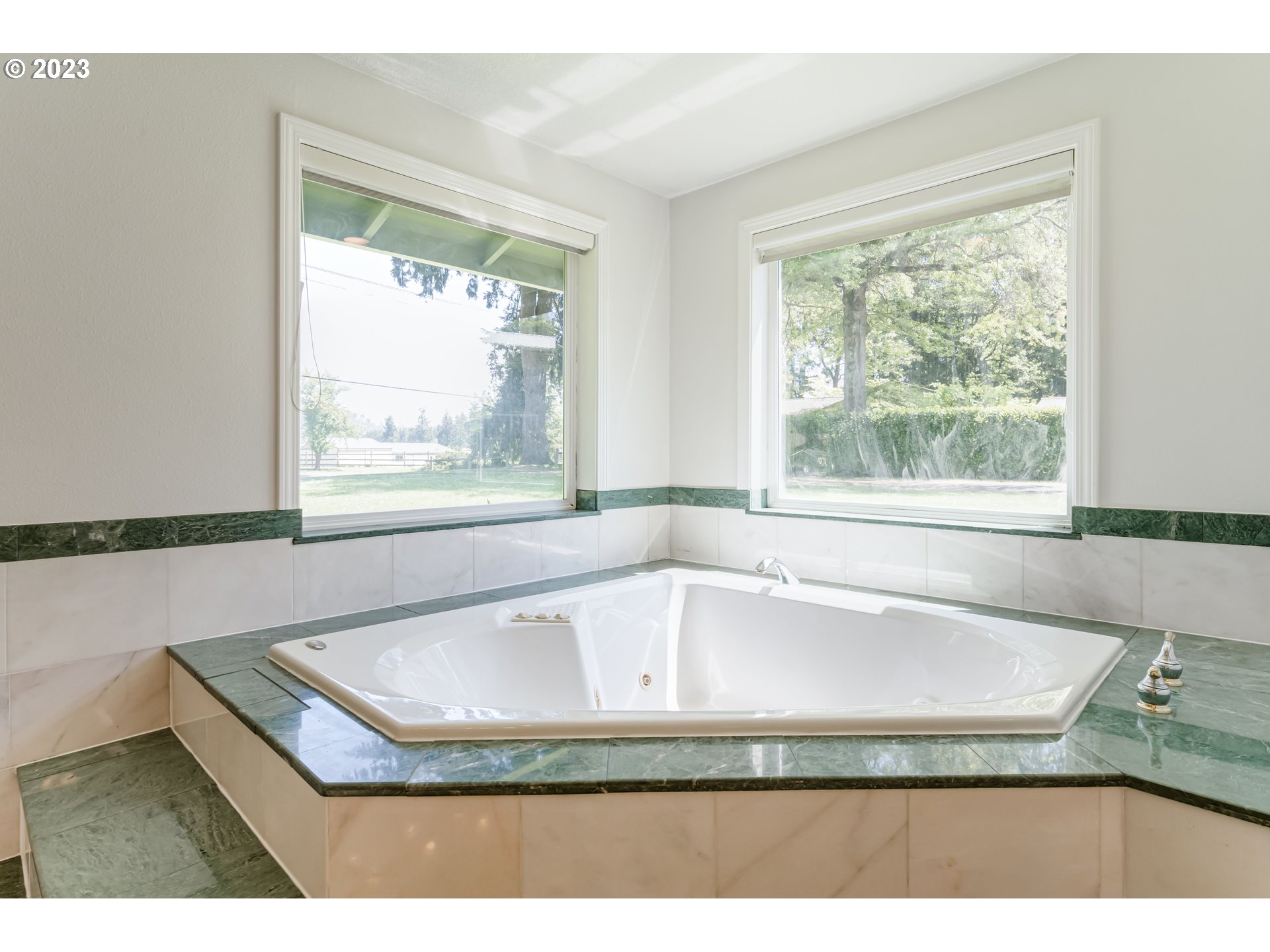 34886 Mathews Road Eugene, OR 97405 - Photo 29 of 48 a bath tub sitting in a bathroom next to a window
