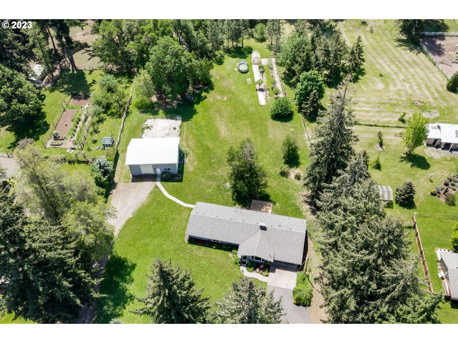 34886 Mathews Road Eugene, OR 97405 - Photo 44 of 48 aerial view of a house with an outdoor space