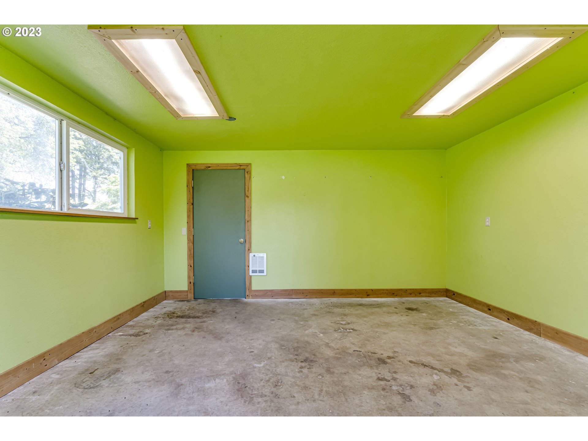 34886 Mathews Road Eugene, OR 97405 - Photo 9 of 48 a view of an empty room with window and stairs