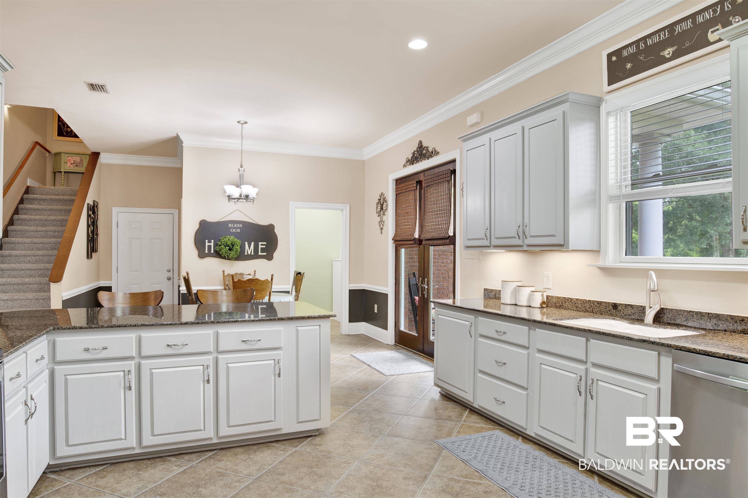 4340 Hamilton Oaks Lane Mobile, AL 36695 - Photo 18 of 51 Kitchen featuring decorative light fixtures, light tile flooring, dishwasher, ornamental molding, and sink