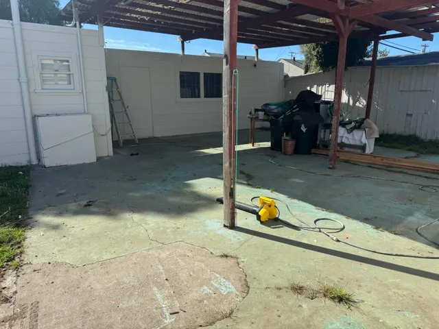 a view of a backyard with a wooden bench