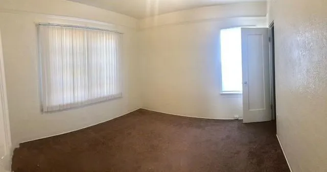an empty room with windows