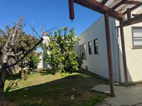 a backyard of a house with lots of green space