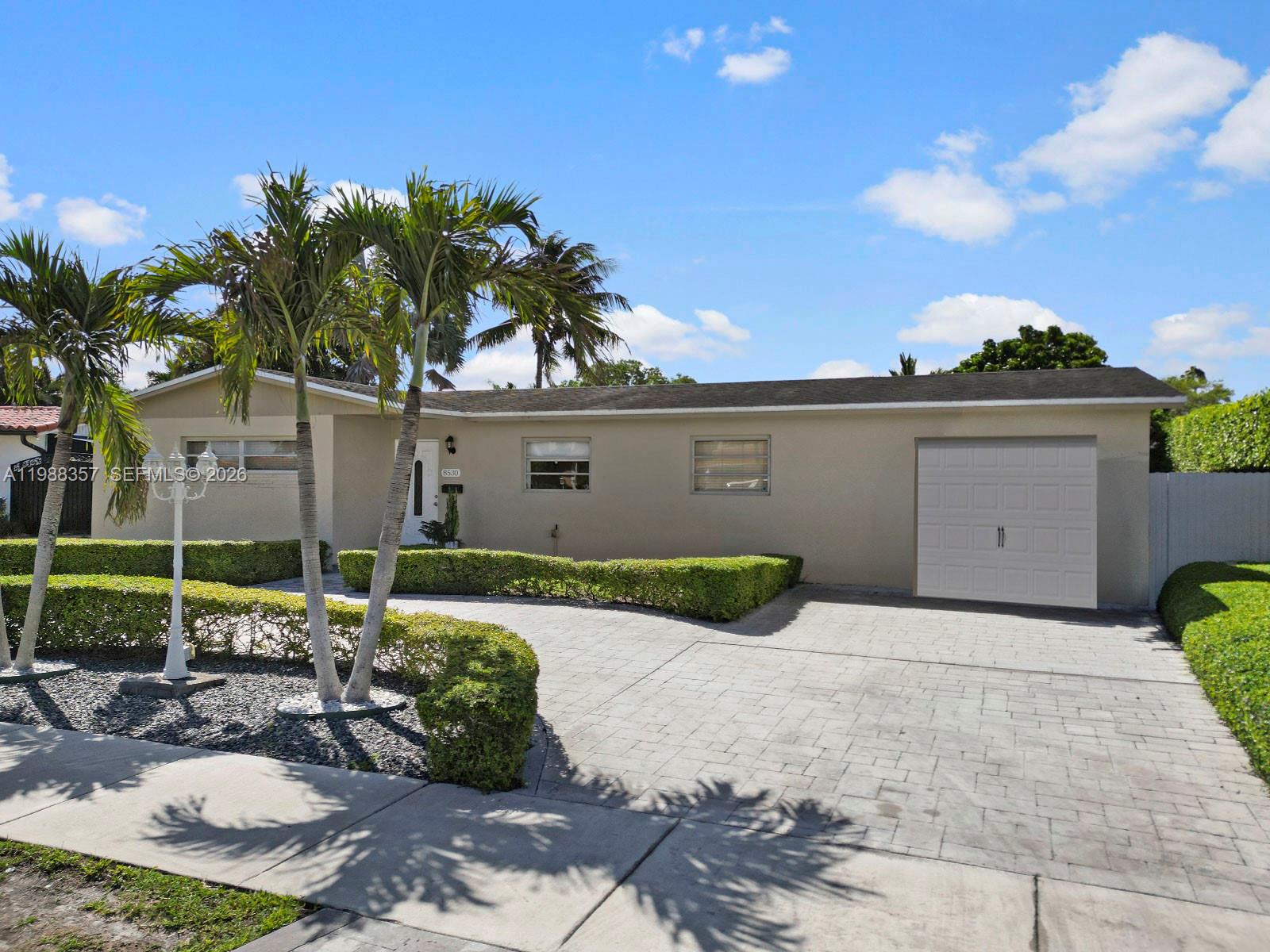 8530 Northwest 179th Street Hialeah, FL 33015 - Photo 1 of 28 a view of backyard with outdoor seating and plants