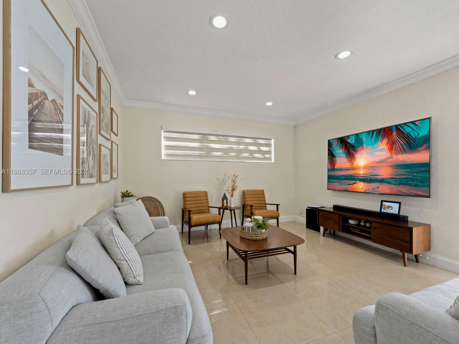 8530 Northwest 179th Street Hialeah, FL 33015 - Photo 12 of 28 a living room with furniture and a flat screen tv