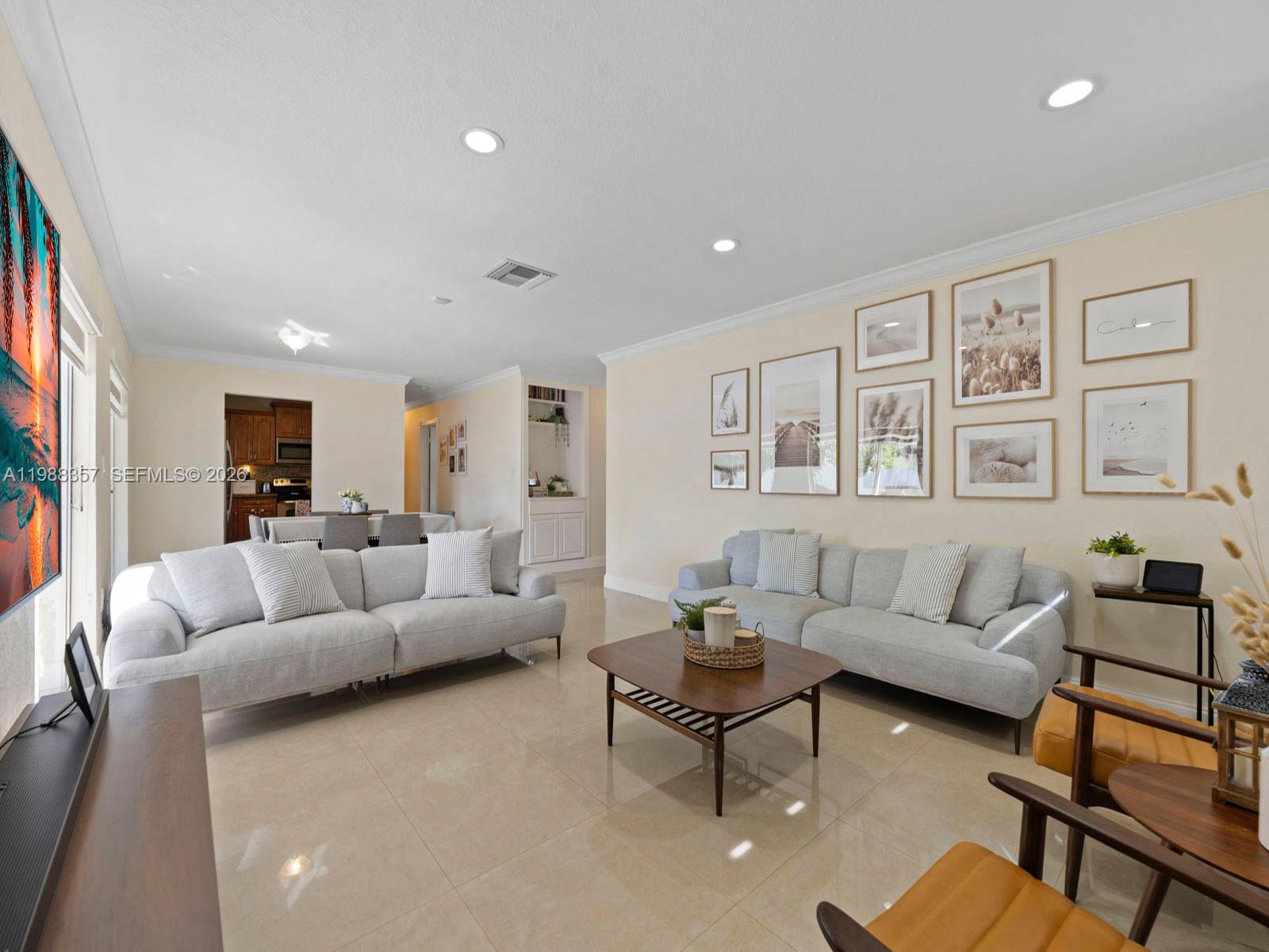 8530 Northwest 179th Street Hialeah, FL 33015 - Photo 13 of 28 a living room with furniture and a large window
