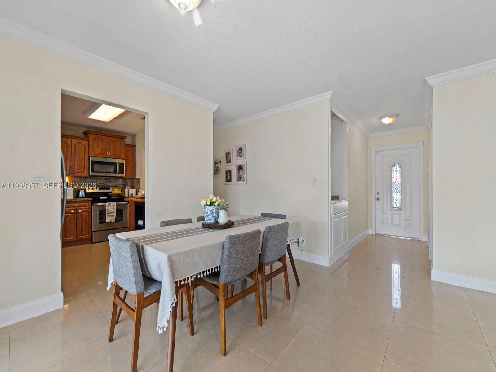 8530 Northwest 179th Street Hialeah, FL 33015 - Photo 14 of 28 a view of a dining room with furniture