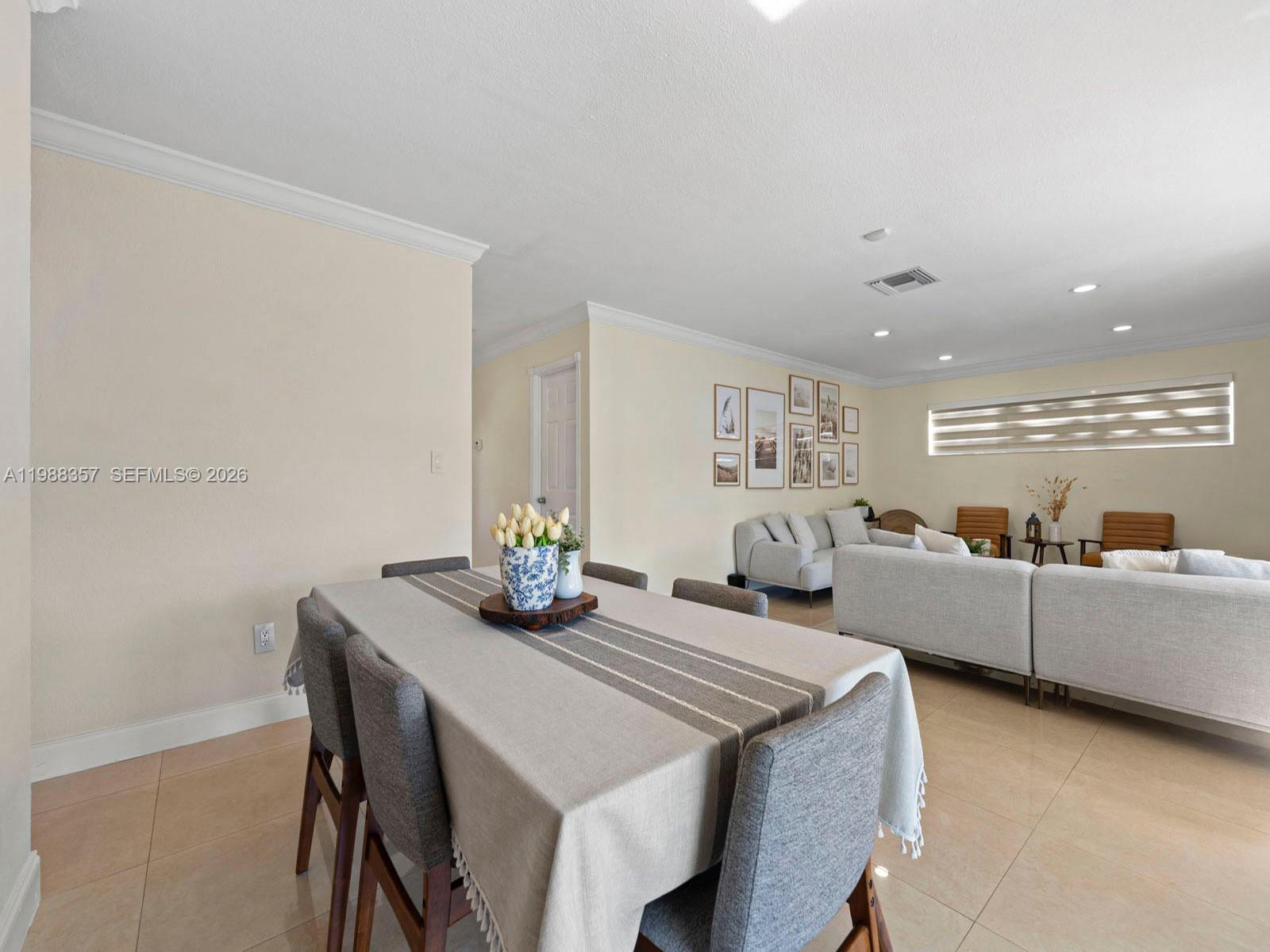 8530 Northwest 179th Street Hialeah, FL 33015 - Photo 16 of 28 a living room with furniture and a table