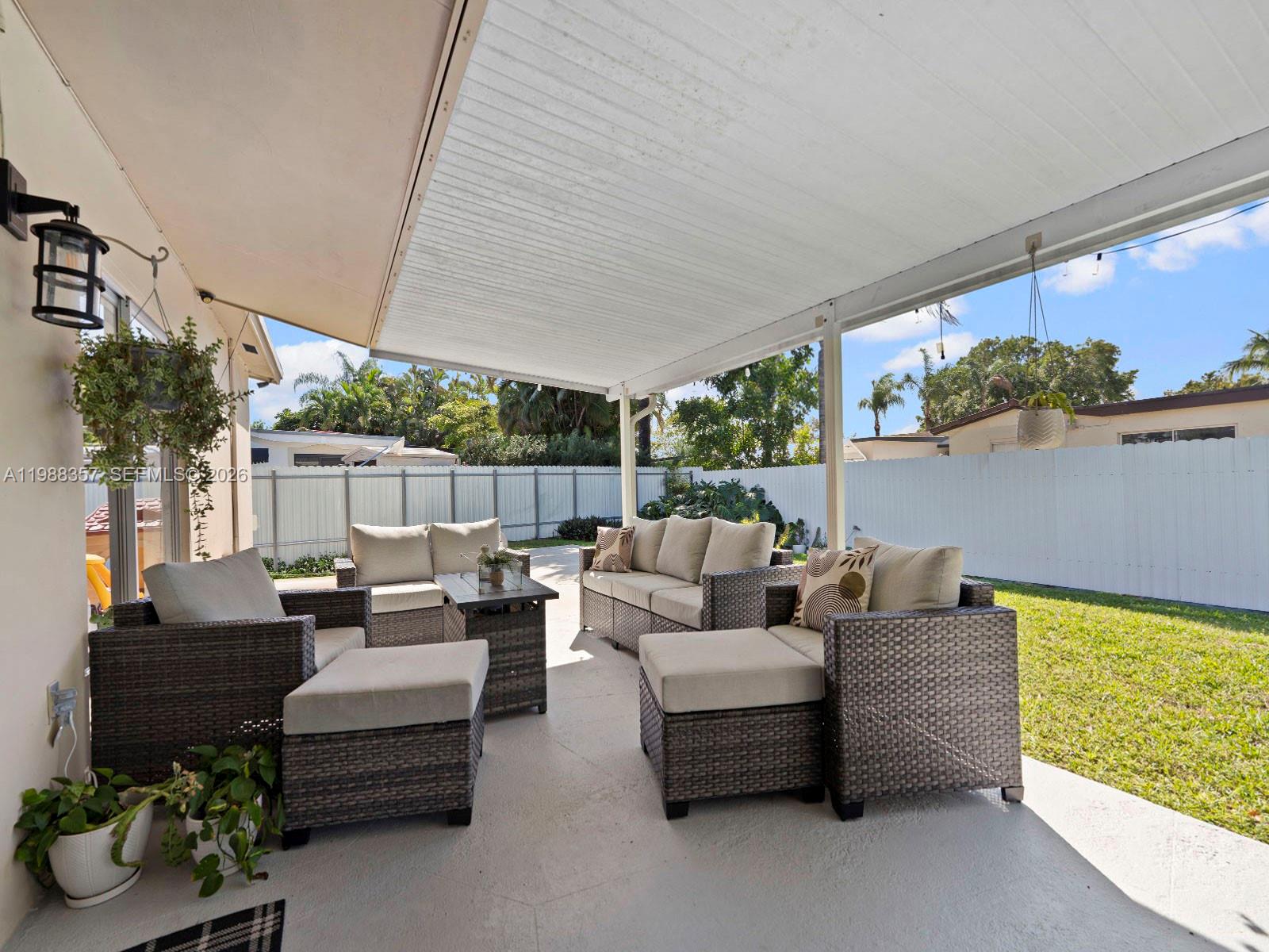 8530 Northwest 179th Street Hialeah, FL 33015 - Photo 26 of 28 a outdoor living space with furniture and garden view