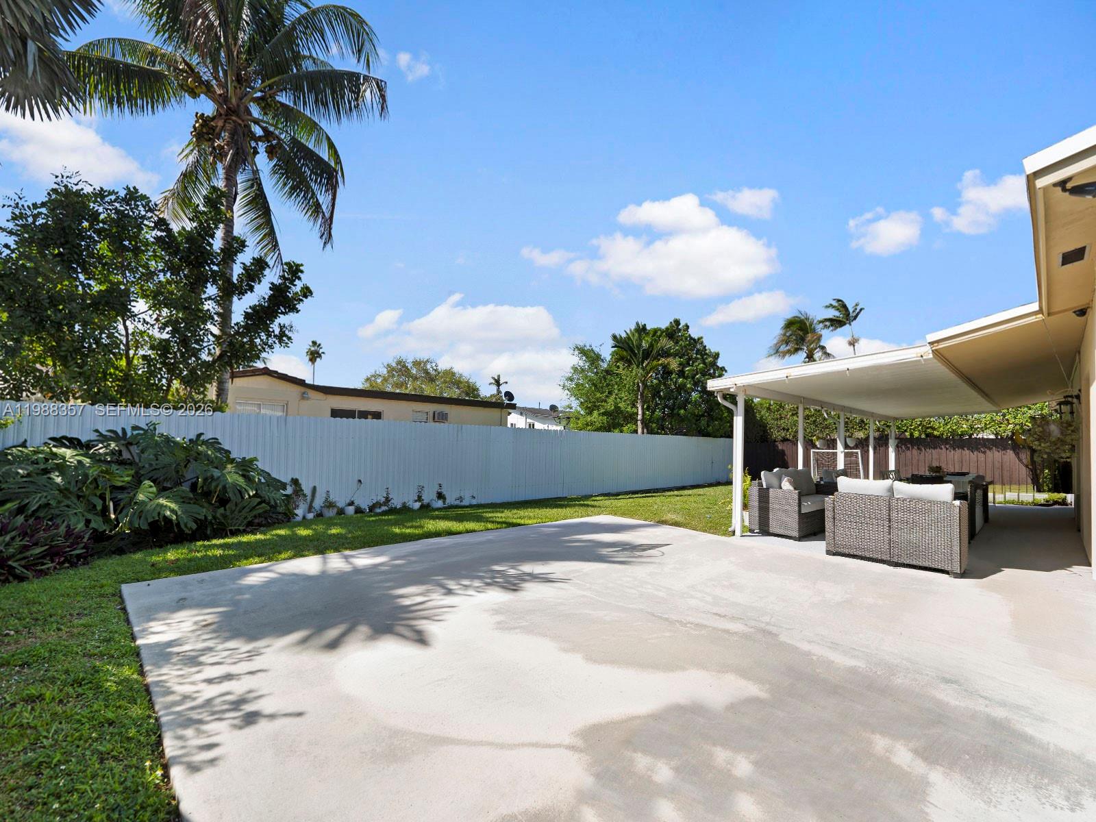 8530 Northwest 179th Street Hialeah, FL 33015 - Photo 28 of 28 a view of a backyard with a patio