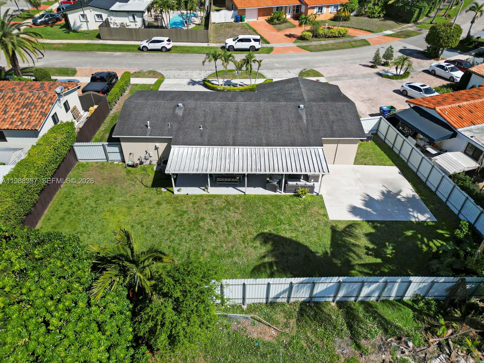 8530 Northwest 179th Street Hialeah, FL 33015 - Photo 3 of 28 an aerial view of a house with a garden