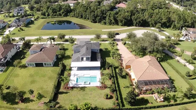a view of a balcony with a yard