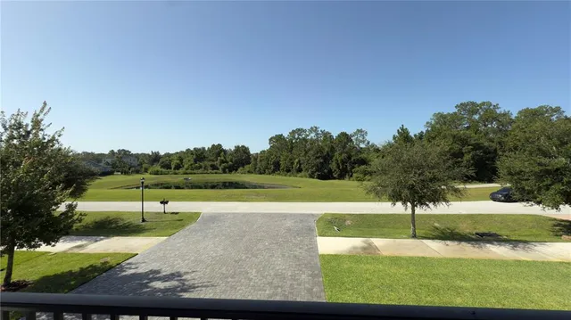 a view of a dining room with furniture wooden floor and chandelier
