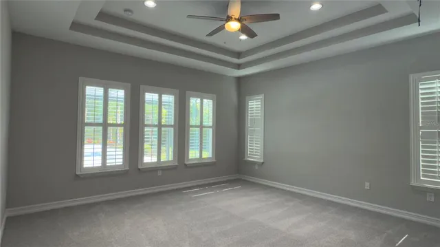 a kitchen with a counter top a stove a sink dishwasher a kitchen island with wooden cabinets and floor