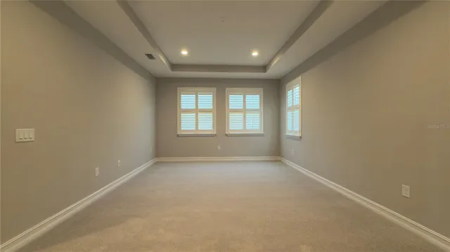 a spacious bathroom with a tub shower and sink