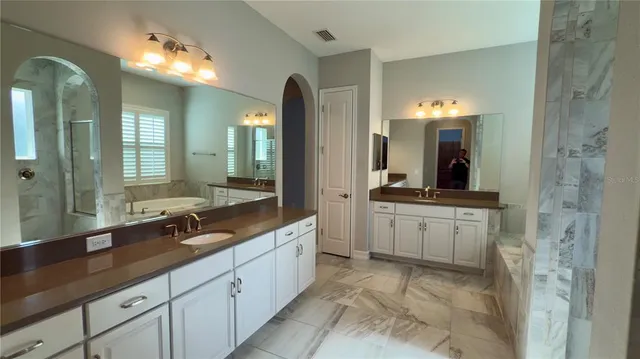 a view of a swimming pool with a yard