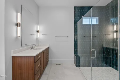 a bathroom with a bathtub and shower