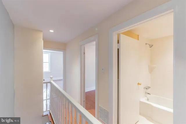 a view of a bathroom from the hallway