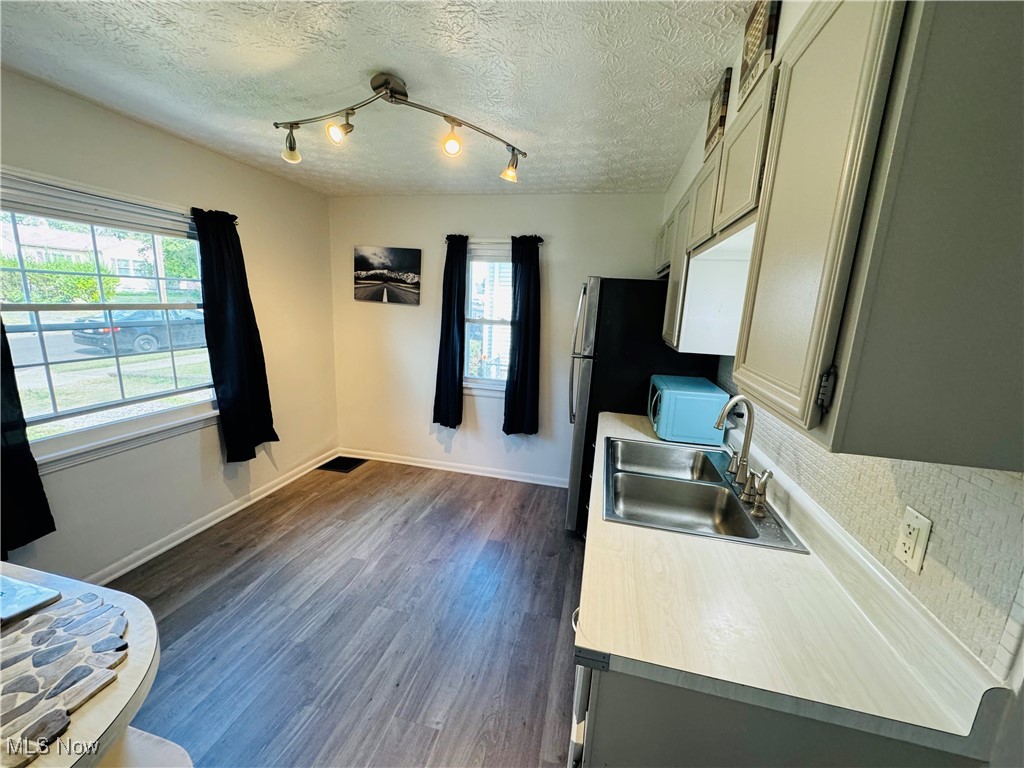 930 Reed Avenue Akron, OH 44306 - Photo 7 of 23 Kitchen featuring a textured ceiling, gray cabinetry, and dark hardwood / wood-style floors