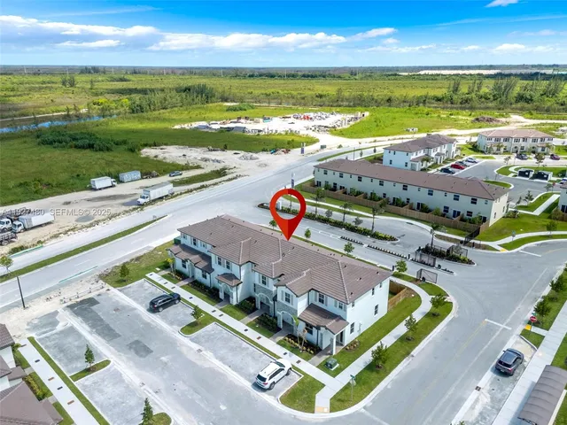 a view of a swimming pool with a table and chairs