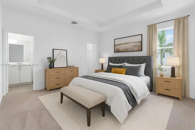 a bedroom with a bed and a cabinets