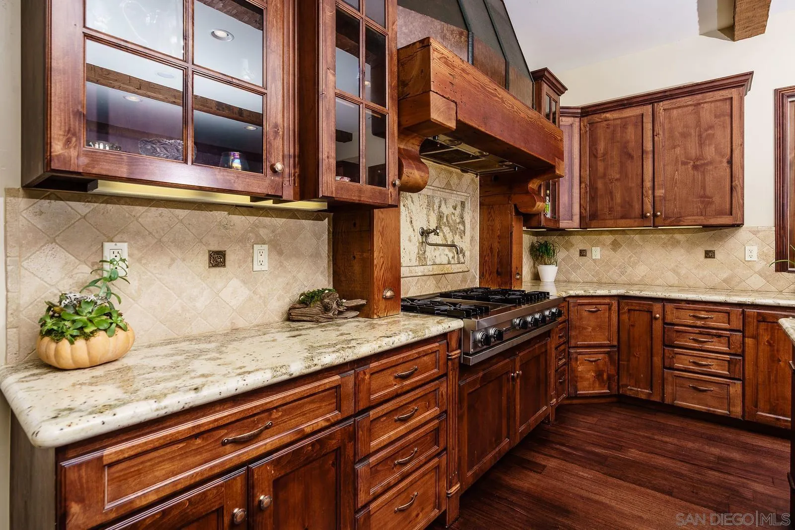 31781 Wrightwood Road Bonsall, CA 92003 - Photo 12 of 46 a kitchen with stainless steel appliances granite countertop a stove and a wooden cabinets
