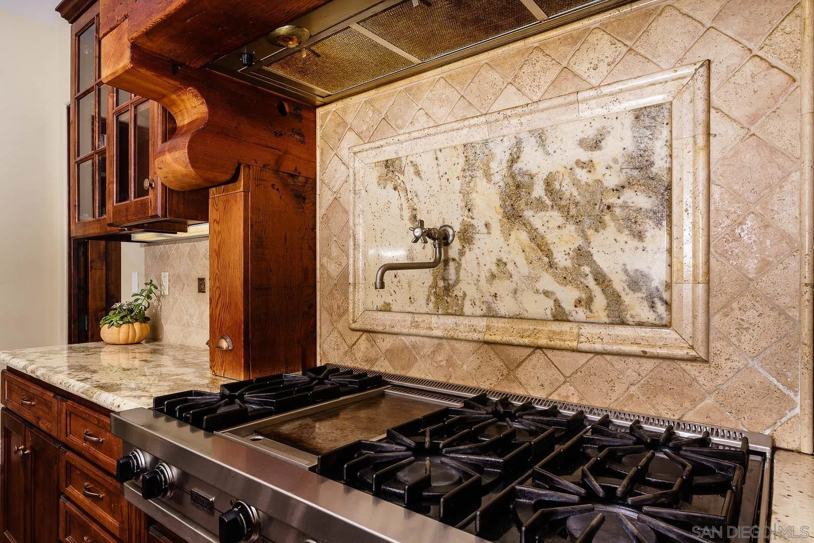 31781 Wrightwood Road Bonsall, CA 92003 - Photo 13 of 46 a close view of a stove a sink and a cabinet