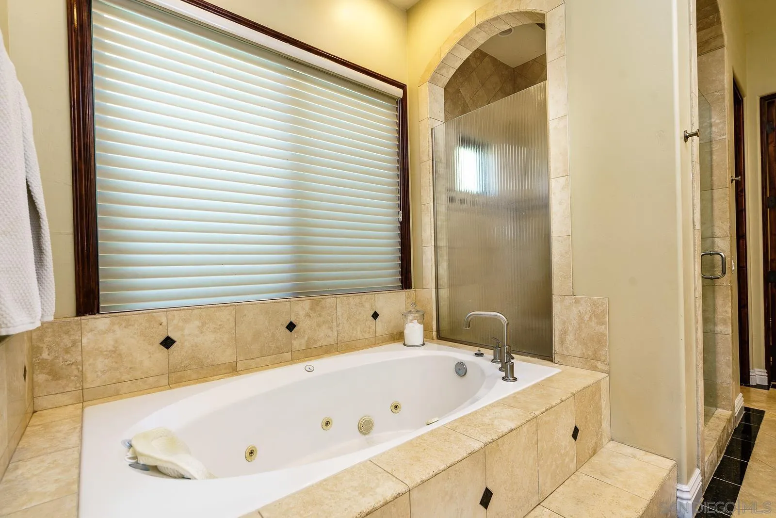 31781 Wrightwood Road Bonsall, CA 92003 - Photo 18 of 46 a bathroom with a bathtub and shower