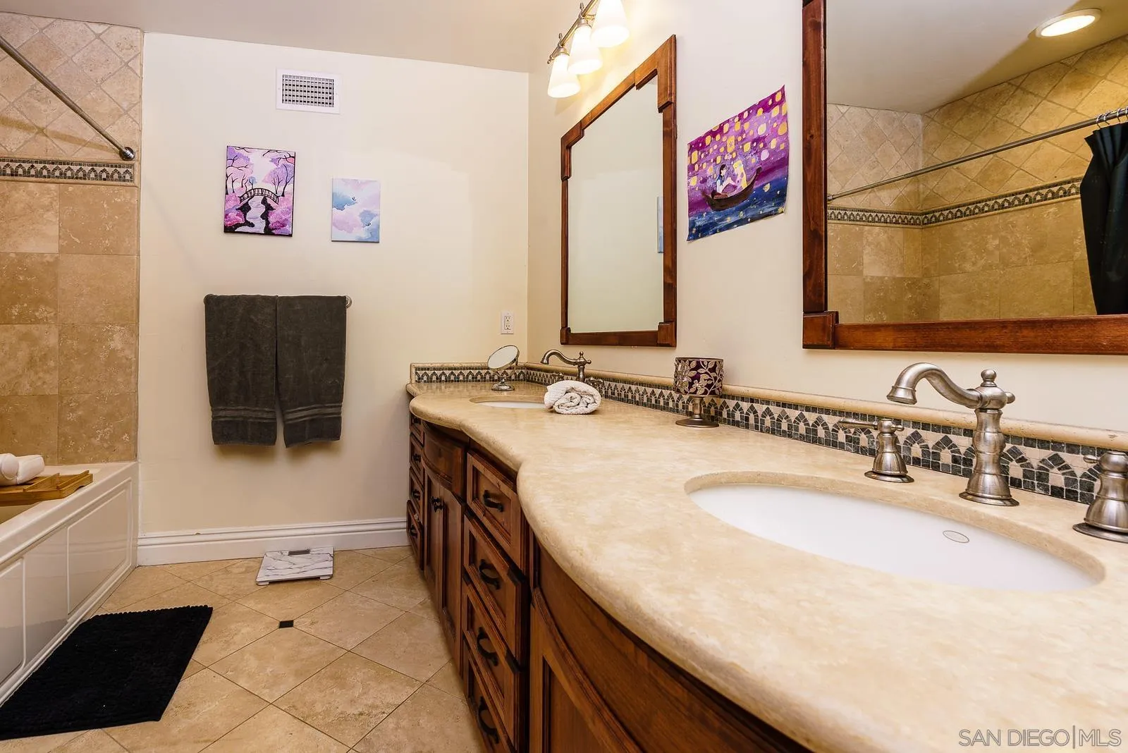 31781 Wrightwood Road Bonsall, CA 92003 - Photo 24 of 46 a bathroom with a sink a vanity and a mirror