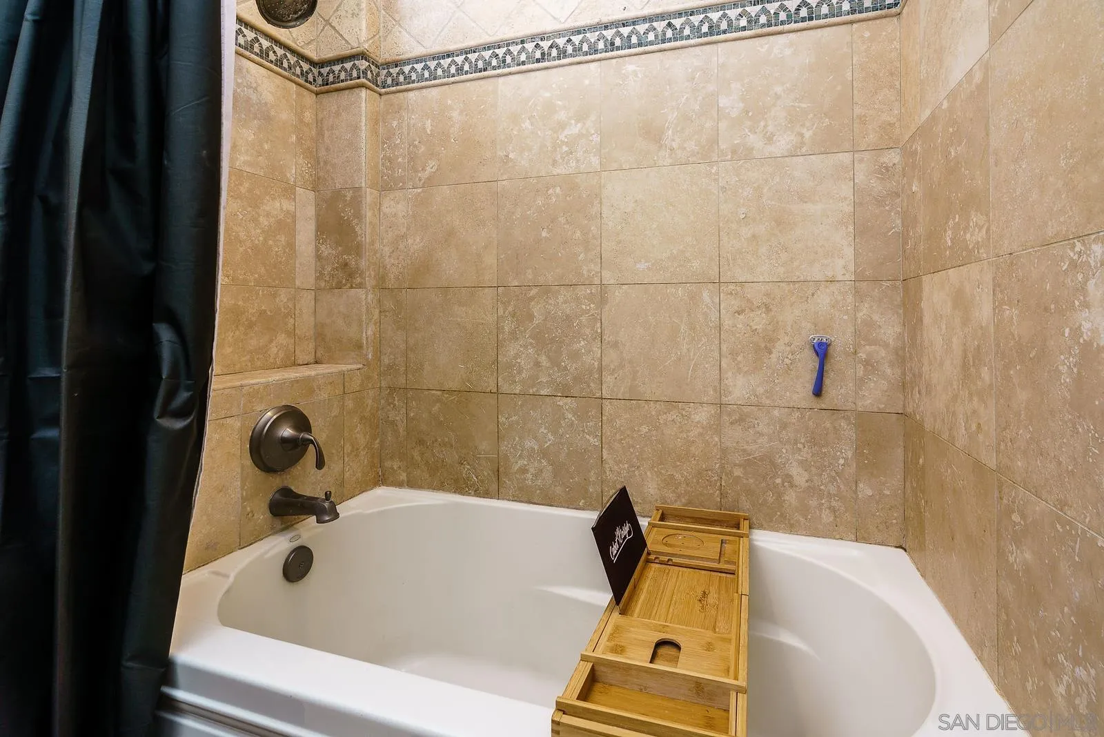 31781 Wrightwood Road Bonsall, CA 92003 - Photo 25 of 46 a bathroom with a tub and a shower