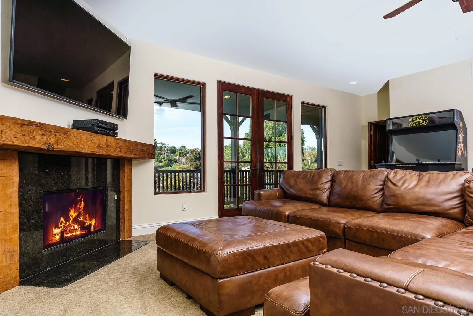 31781 Wrightwood Road Bonsall, CA 92003 - Photo 28 of 46 a living room with furniture a flat screen tv and a fireplace