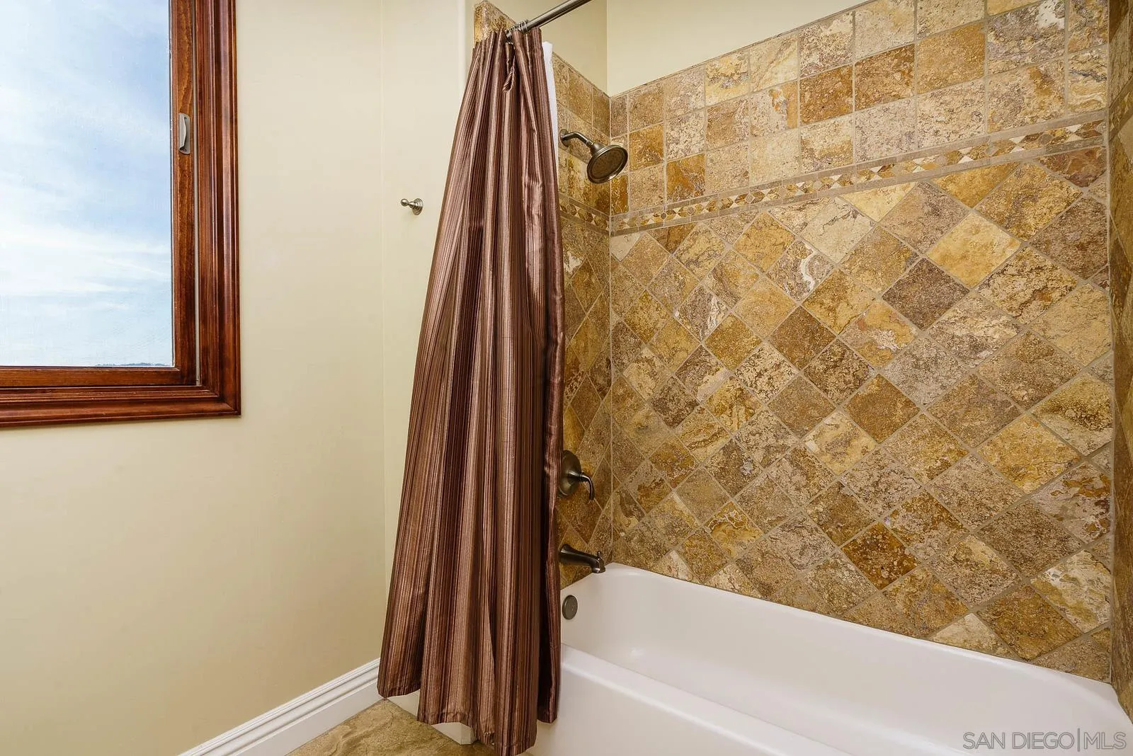 31781 Wrightwood Road Bonsall, CA 92003 - Photo 34 of 46 a bathroom with a shower curtain and a sink