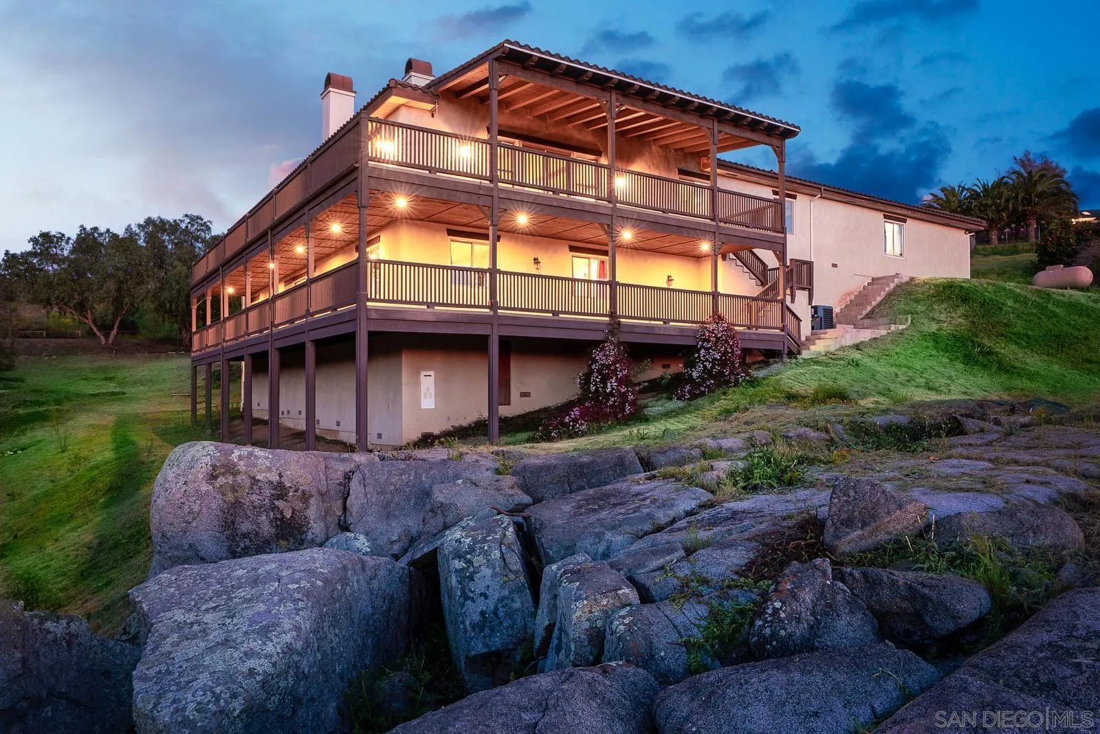 31781 Wrightwood Road Bonsall, CA 92003 - Photo 4 of 46 a view of a house with a small yard and plants