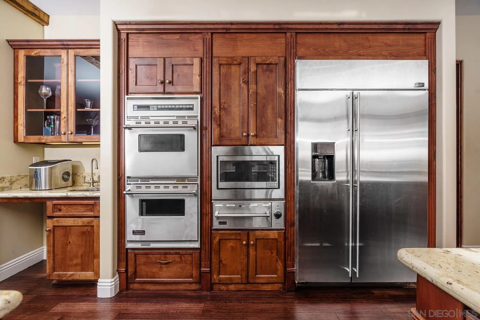 31781 Wrightwood Road Bonsall, CA 92003 - Photo 10 of 46 a kitchen with stainless steel appliances granite countertop a refrigerator and a stove