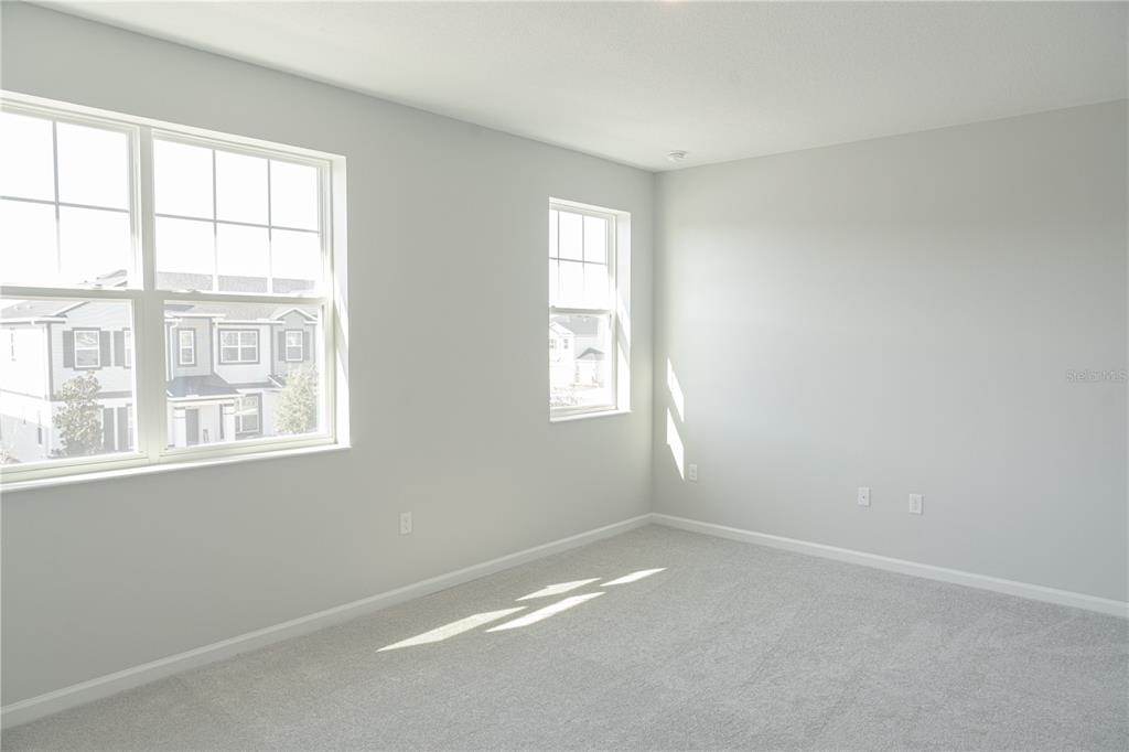 583 Pothos Street Apopka, FL 32703 - Photo 14 of 26 an empty room with a window