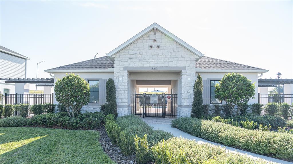 583 Pothos Street Apopka, FL 32703 - Photo 23 of 26 a front view of a house with garden