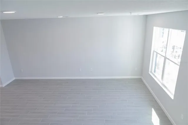 a view of an empty room with a window