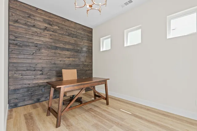 a view of a workspace with furniture