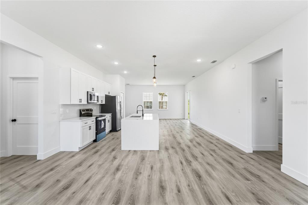 2600 Southwest 146th Pl Road Ocala, FL 34473 - Photo 2 of 40 a view of kitchen with wooden floor