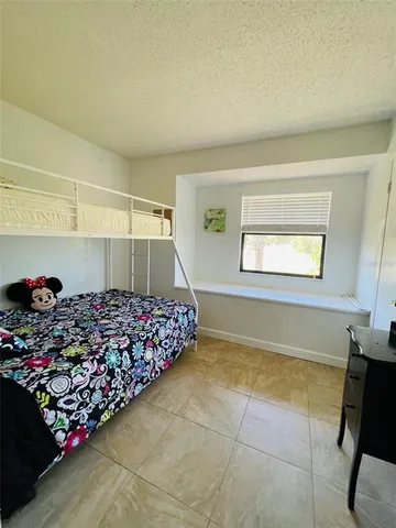 a bathroom with a double vanity sink mirror and bathtub