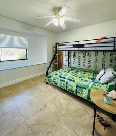 a view of a swimming pool with an outdoor seating and a yard